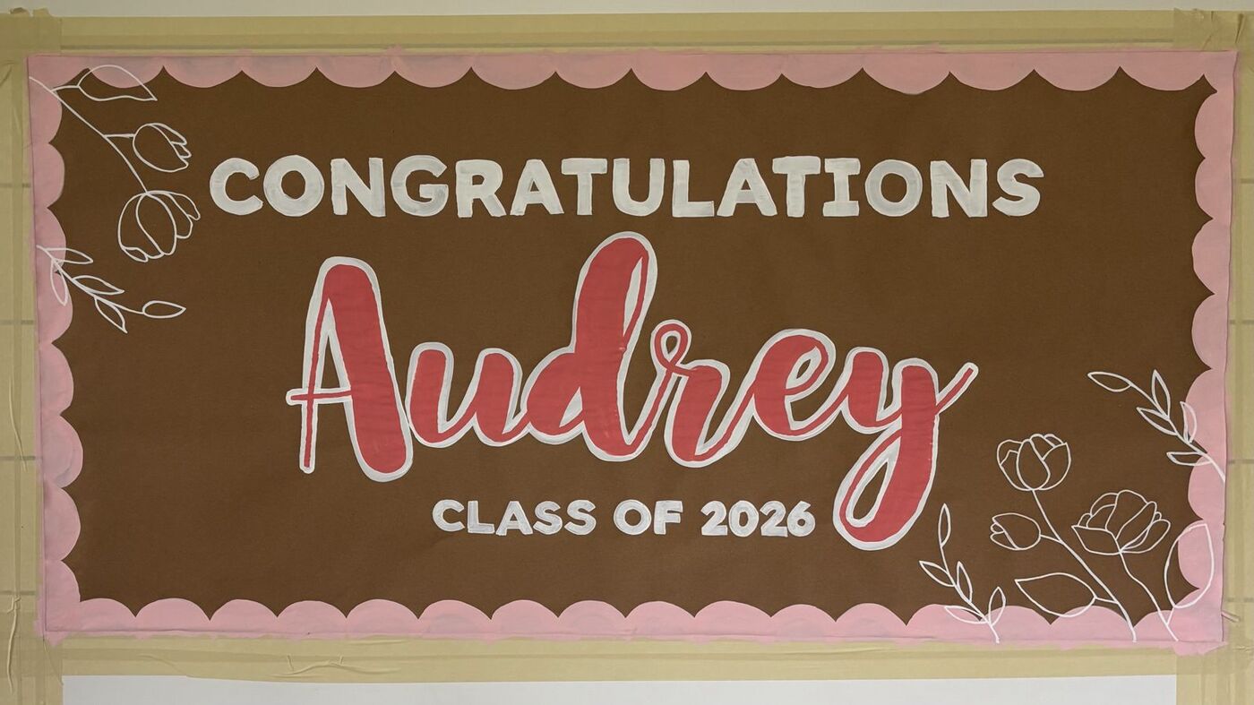 Hand-painted banner: Congratulations Audrey, class of 2026